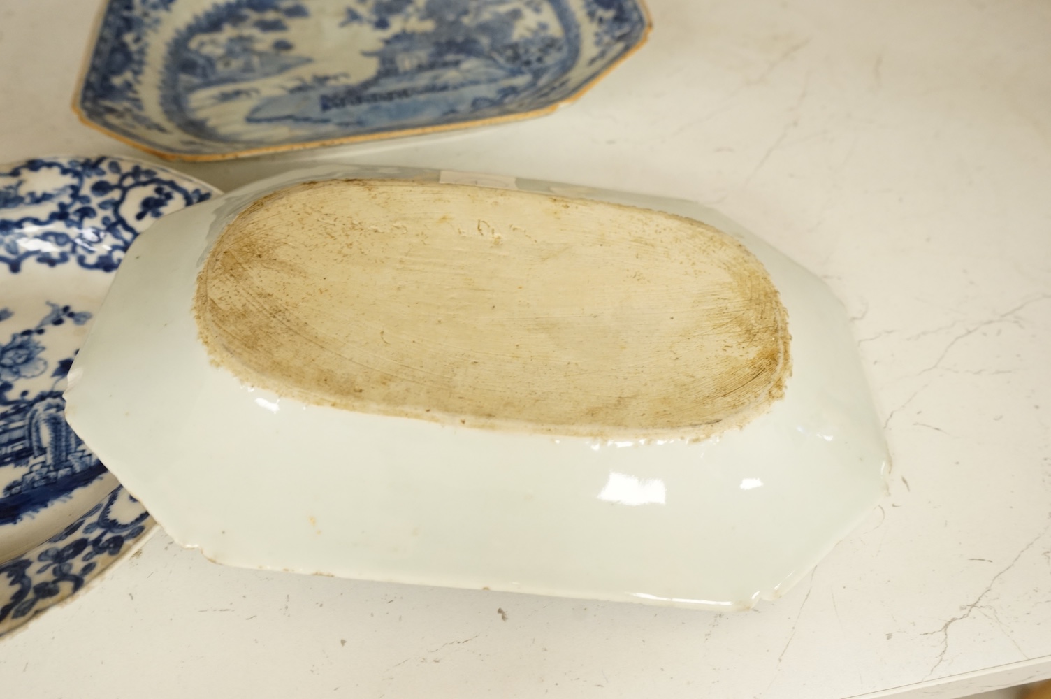 Two 18th century Chinese blue and white dishes and a similar plate, largest 29cm